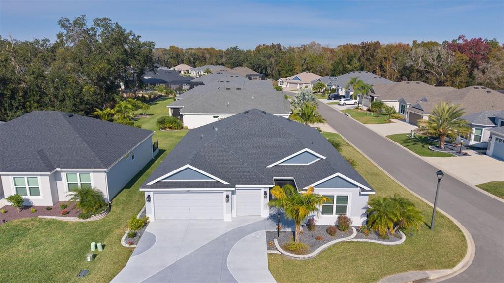 1177 Elkington Road The Villages, FL 34762 - Photo 50 of 59 an aerial view of a house with swimming pool and mountain view