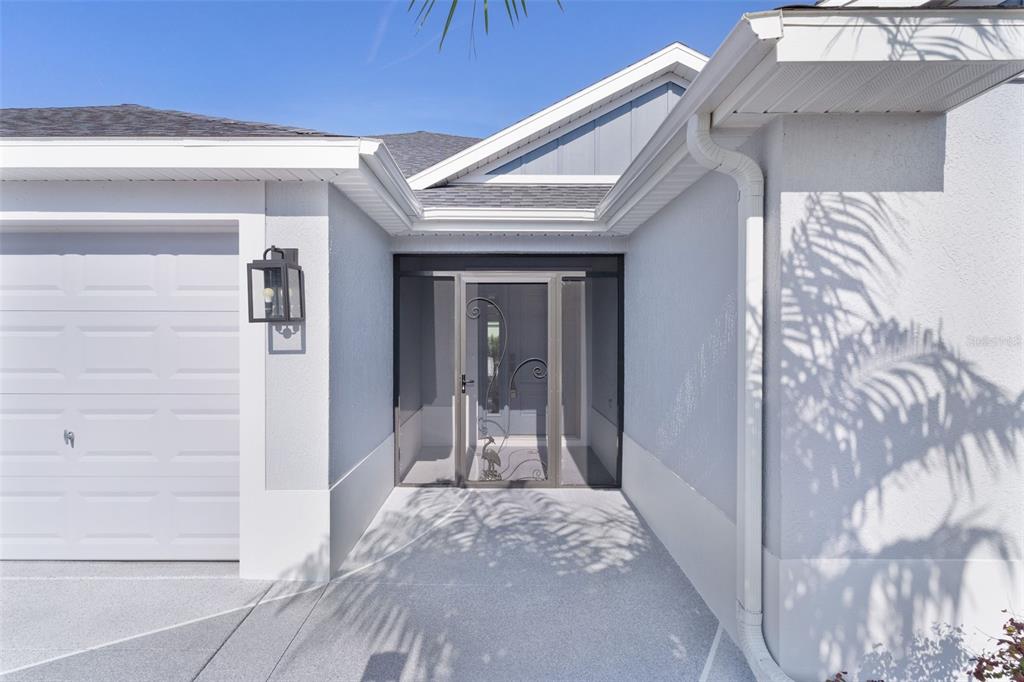 1177 Elkington Road The Villages, FL 34762 - Photo 5 of 59 a view of a hallway with wooden floor and staircase