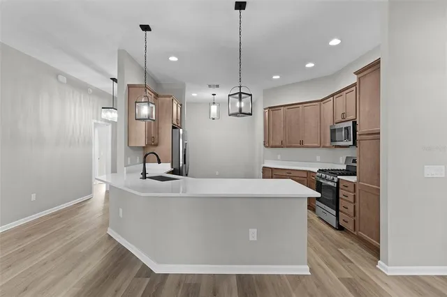 a large kitchen with stainless steel appliances