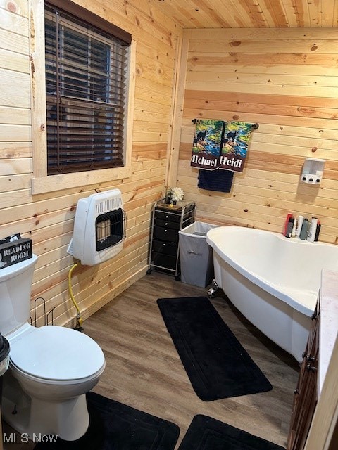 2445 McCord Hill Road Wellsburg, WV 26070 - Photo 5 of 37 Bathroom with a soaking tub, heating unit, wood walls, wood ceiling, and dark wood-type flooring