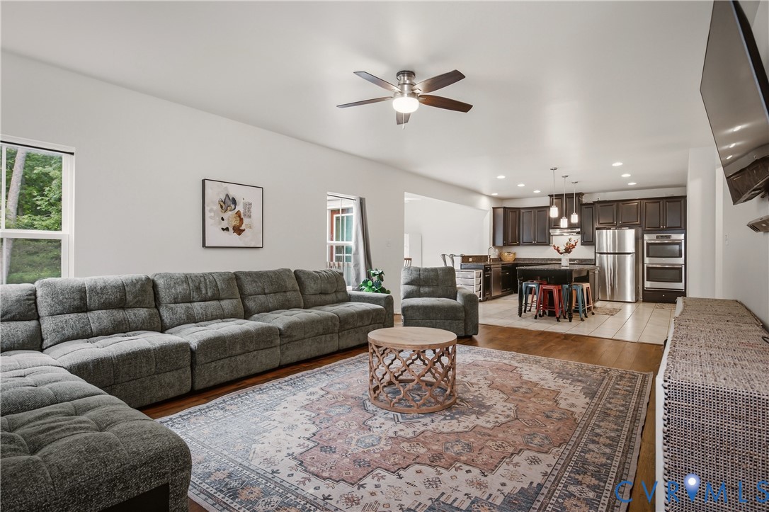 9013 Bailey Hill Road Midlothian, VA 23112 - Photo 31 of 56 Open-concept living area featuring vaulted ceiling