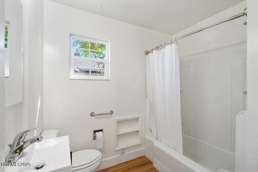 80 Locust Street Reno, NV 89502 - Photo 17 of 49 a bathroom with a sink a toilet and shower