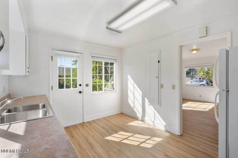 80 Locust Street Reno, NV 89502 - Photo 34 of 49 a view of an entryway with wooden floor and a sink