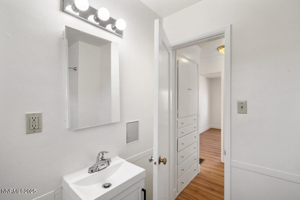 80 Locust Street Reno, NV 89502 - Photo 39 of 49 a bathroom with a sink a mirror and a shower