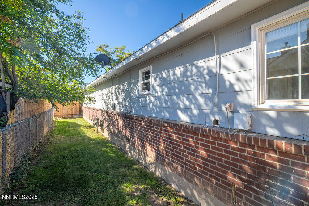 80 Locust Street Reno, NV 89502 - Photo 46 of 49 a view of a yard with wooden fence
