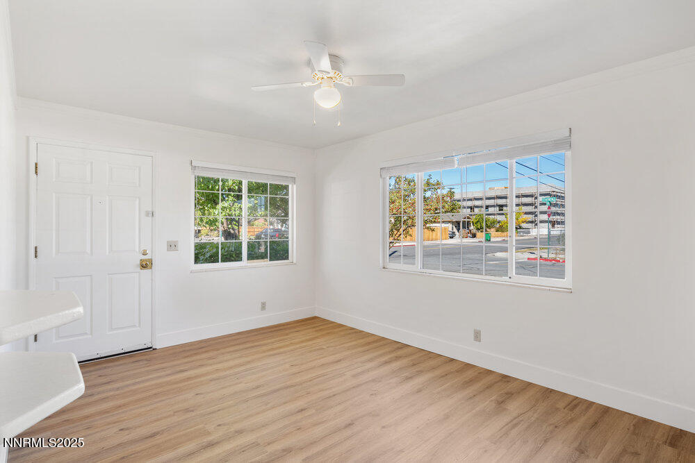 80 Locust Street Reno, NV 89502 - Photo 9 of 49 wooden floor in an empty room with a window
