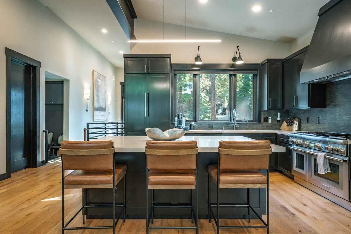 1055 Martis Landing, Unit B Truckee, CA 96161 - Photo 12 of 24 a dining room with furniture a large window and a kitchen view