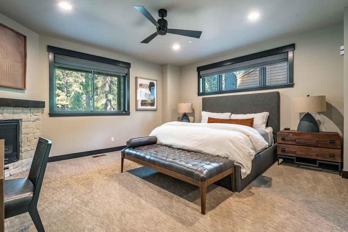 1055 Martis Landing, Unit B Truckee, CA 96161 - Photo 15 of 24 a bedroom with a bed and a large window