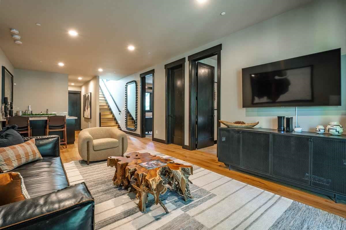 1055 Martis Landing, Unit B Truckee, CA 96161 - Photo 20 of 24 a living room with furniture and a flat screen tv