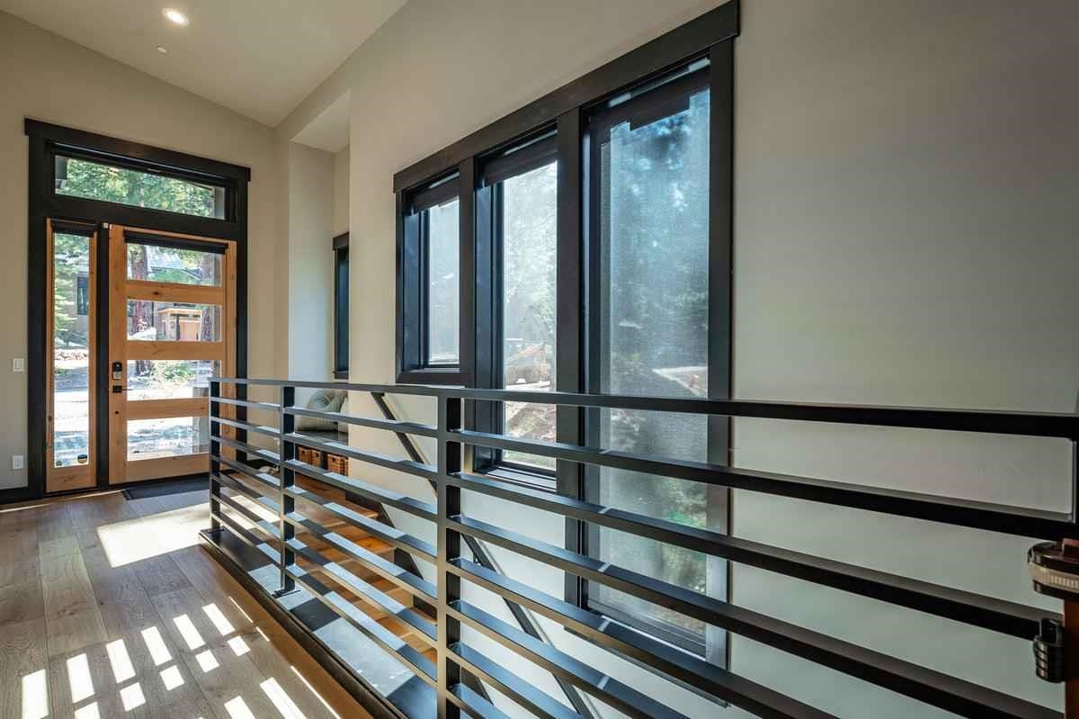 1055 Martis Landing, Unit B Truckee, CA 96161 - Photo 7 of 24 a view of a balcony with chairs and wooden floor