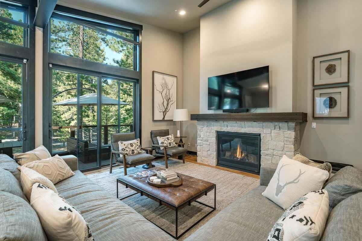 1055 Martis Landing, Unit B Truckee, CA 96161 - Photo 8 of 24 a living room with furniture a flat screen tv and a fireplace
