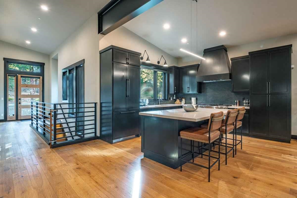 1055 Martis Landing, Unit B Truckee, CA 96161 - Photo 10 of 24 a kitchen with stainless steel appliances kitchen island granite countertop a refrigerator and a sink