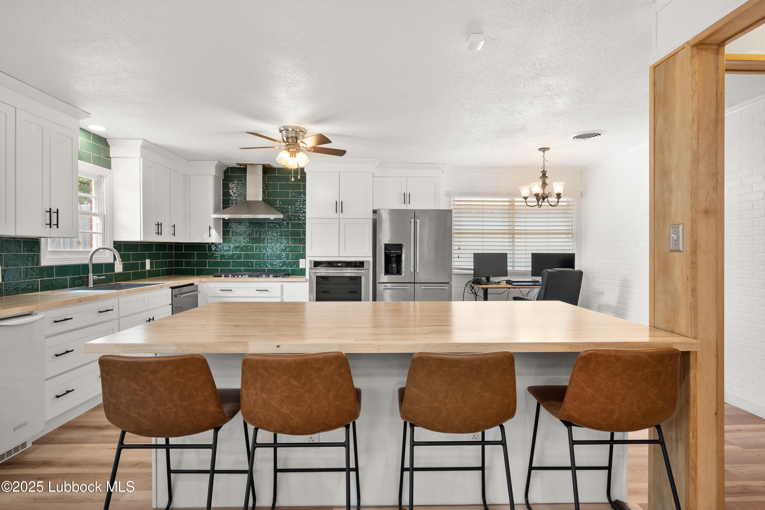 6405 Joliet Avenue Lubbock, TX 79413 - Photo 13 of 30 a large kitchen with dining table and chairs