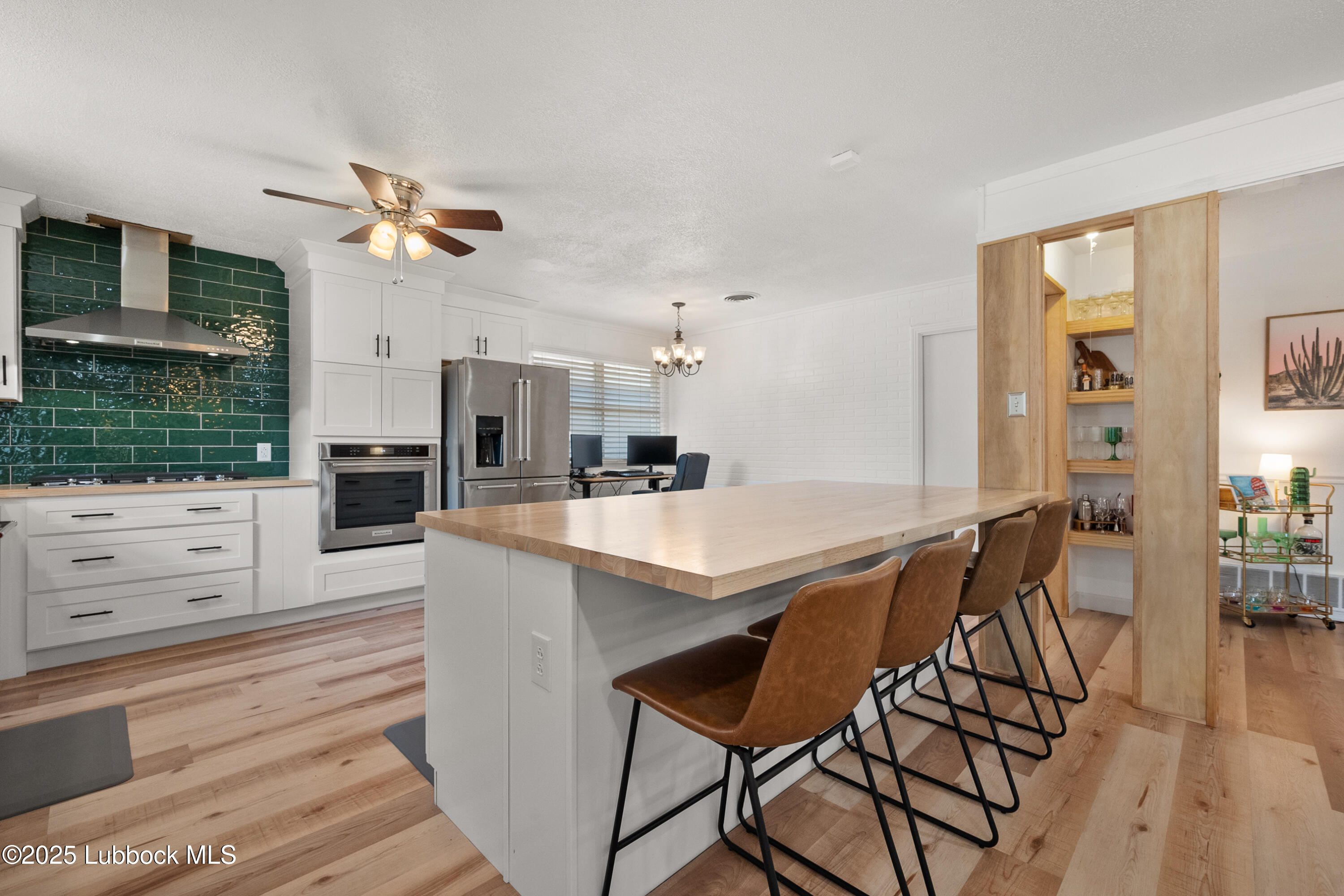 6405 Joliet Avenue Lubbock, TX 79413 - Photo 14 of 30 a view of kitchen with cabinets and outdoor space