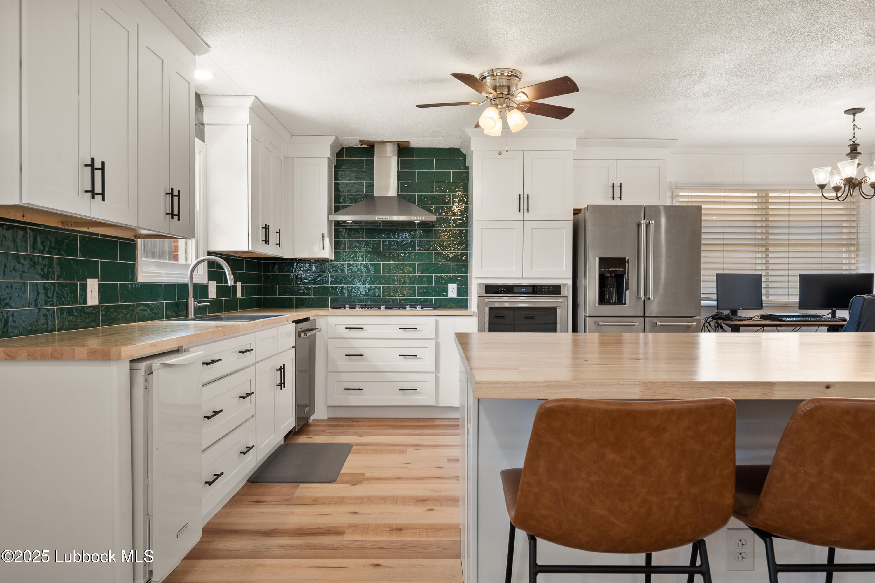 6405 Joliet Avenue Lubbock, TX 79413 - Photo 20 of 30 a large kitchen with cabinets