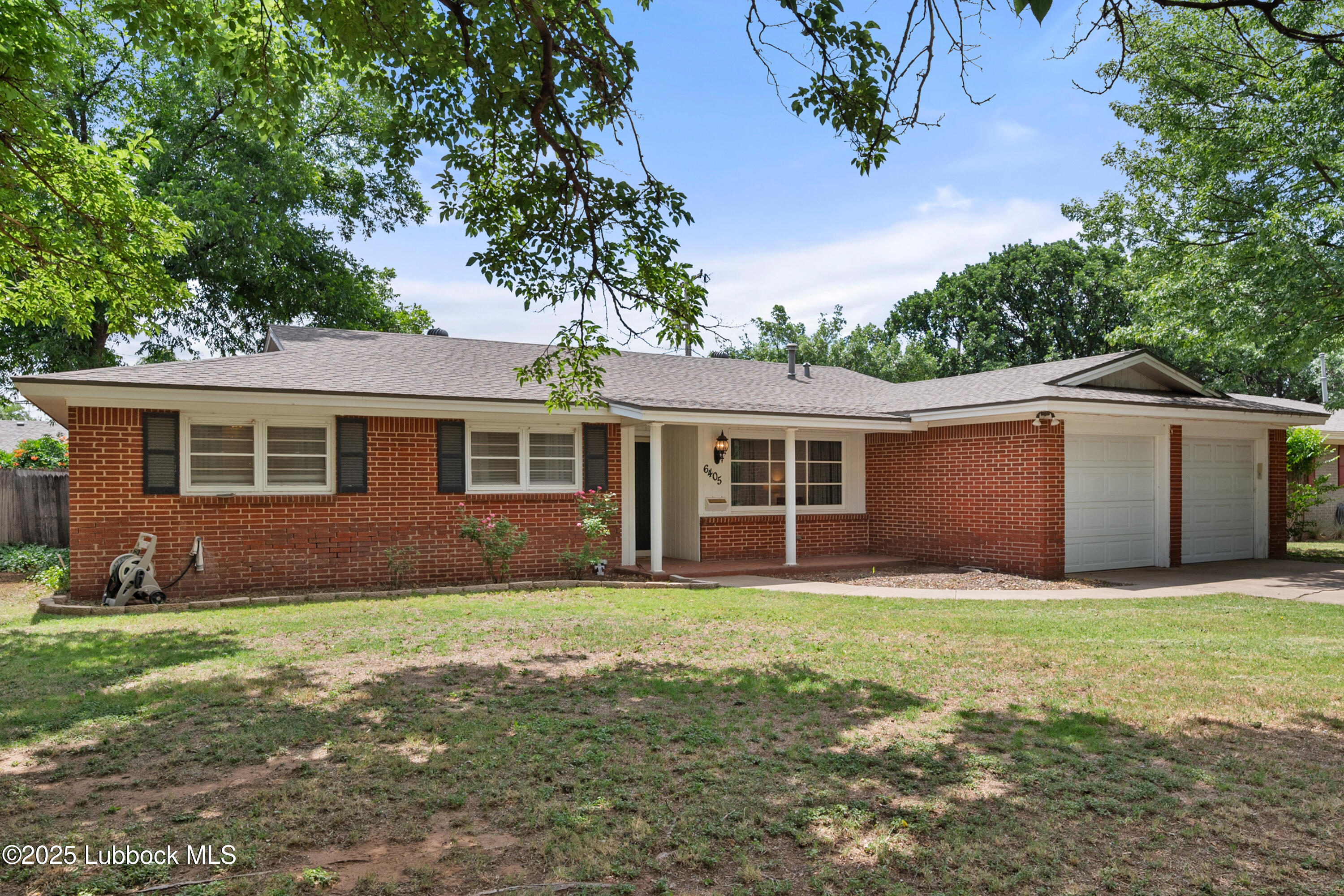 6405 Joliet Avenue Lubbock, TX 79413 - Photo 2 of 30 a view of a house with a yard