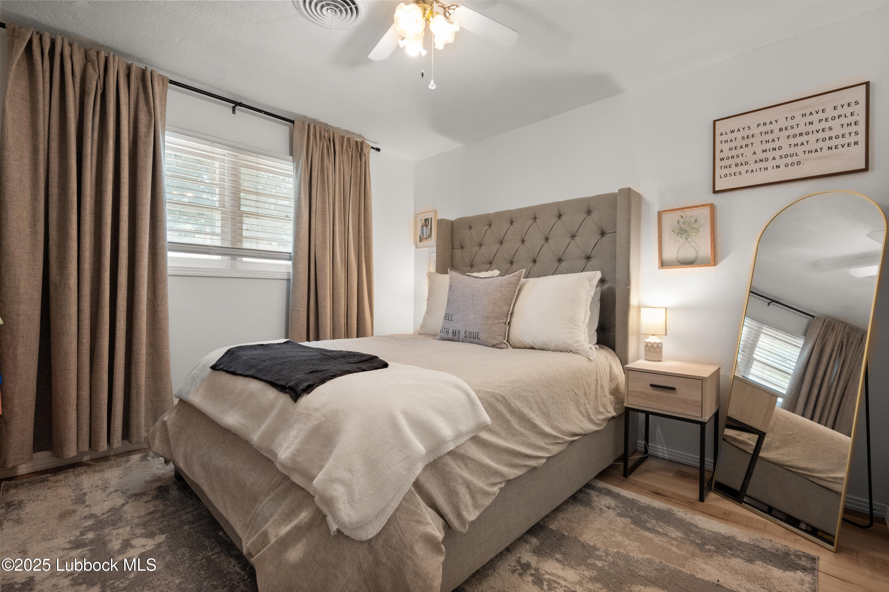 6405 Joliet Avenue Lubbock, TX 79413 - Photo 26 of 30 a bed sitting in a bedroom next to a window