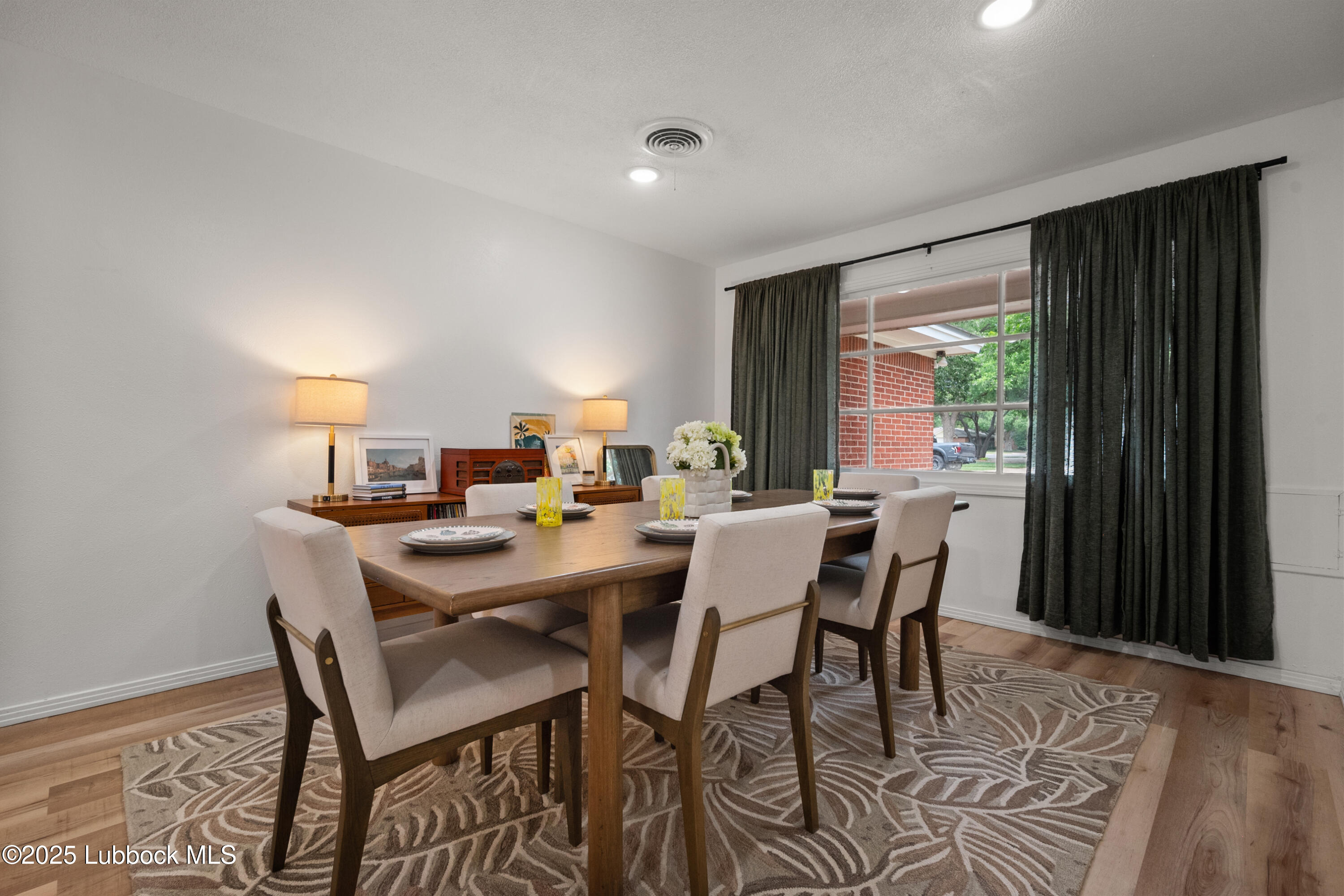 6405 Joliet Avenue Lubbock, TX 79413 - Photo 6 of 30 a view of a dining room with furniture window and outside view