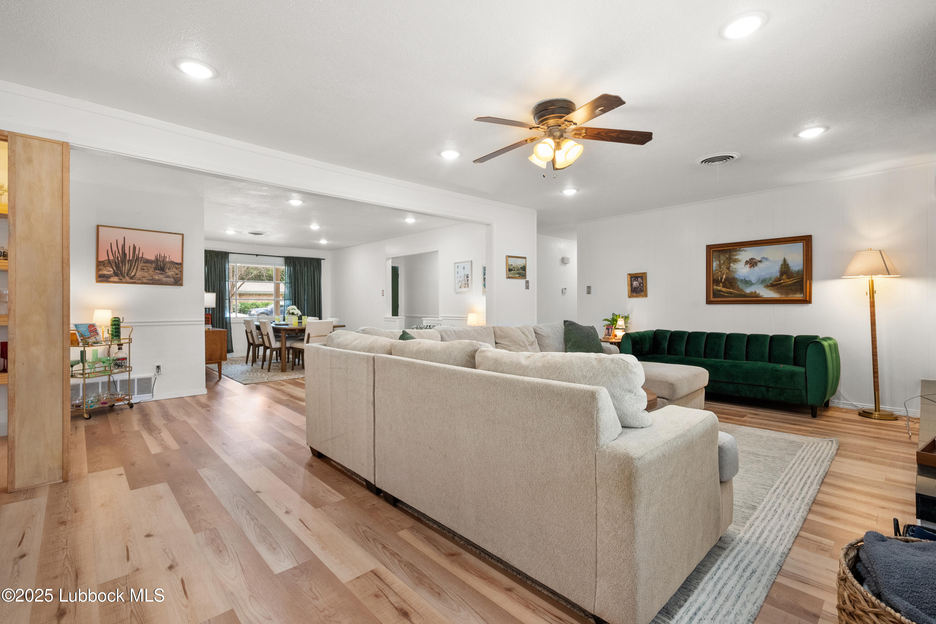 6405 Joliet Avenue Lubbock, TX 79413 - Photo 10 of 30 a living room with furniture and kitchen view