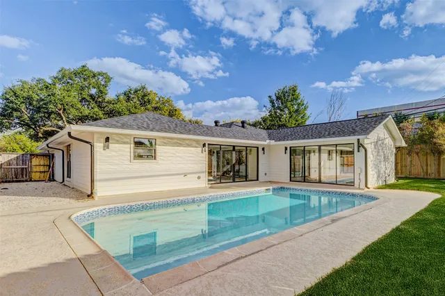swimming pool view with seating space