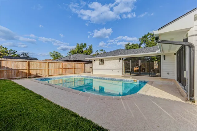 a view of a backyard with sitting area