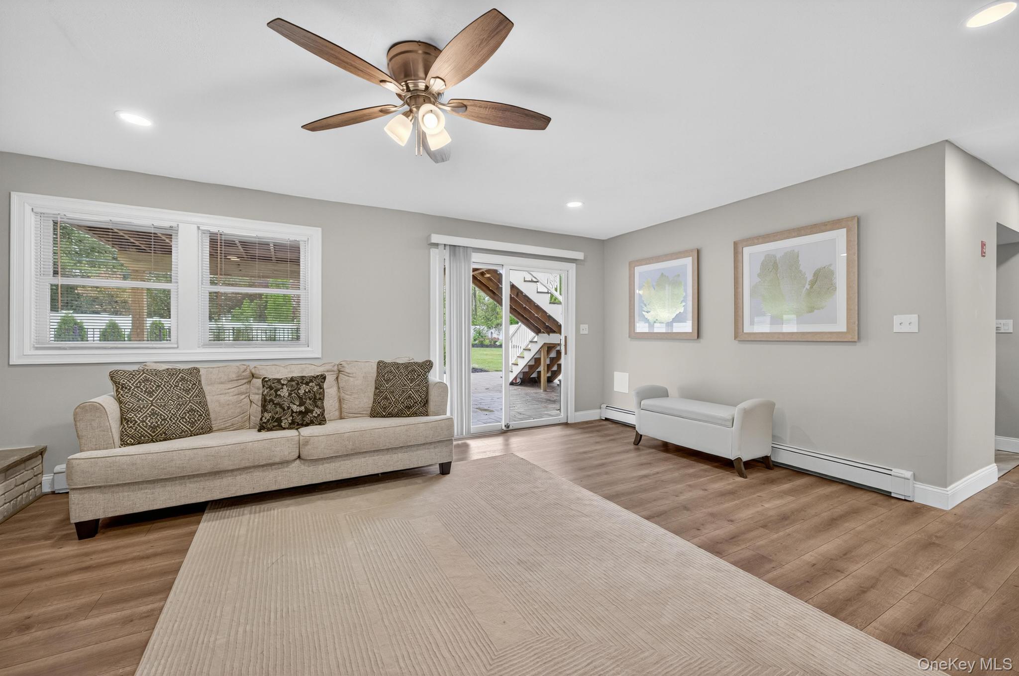 12 Farmstead Road Commack, NY 11725 - Photo 23 of 28 a living room with furniture and a large window