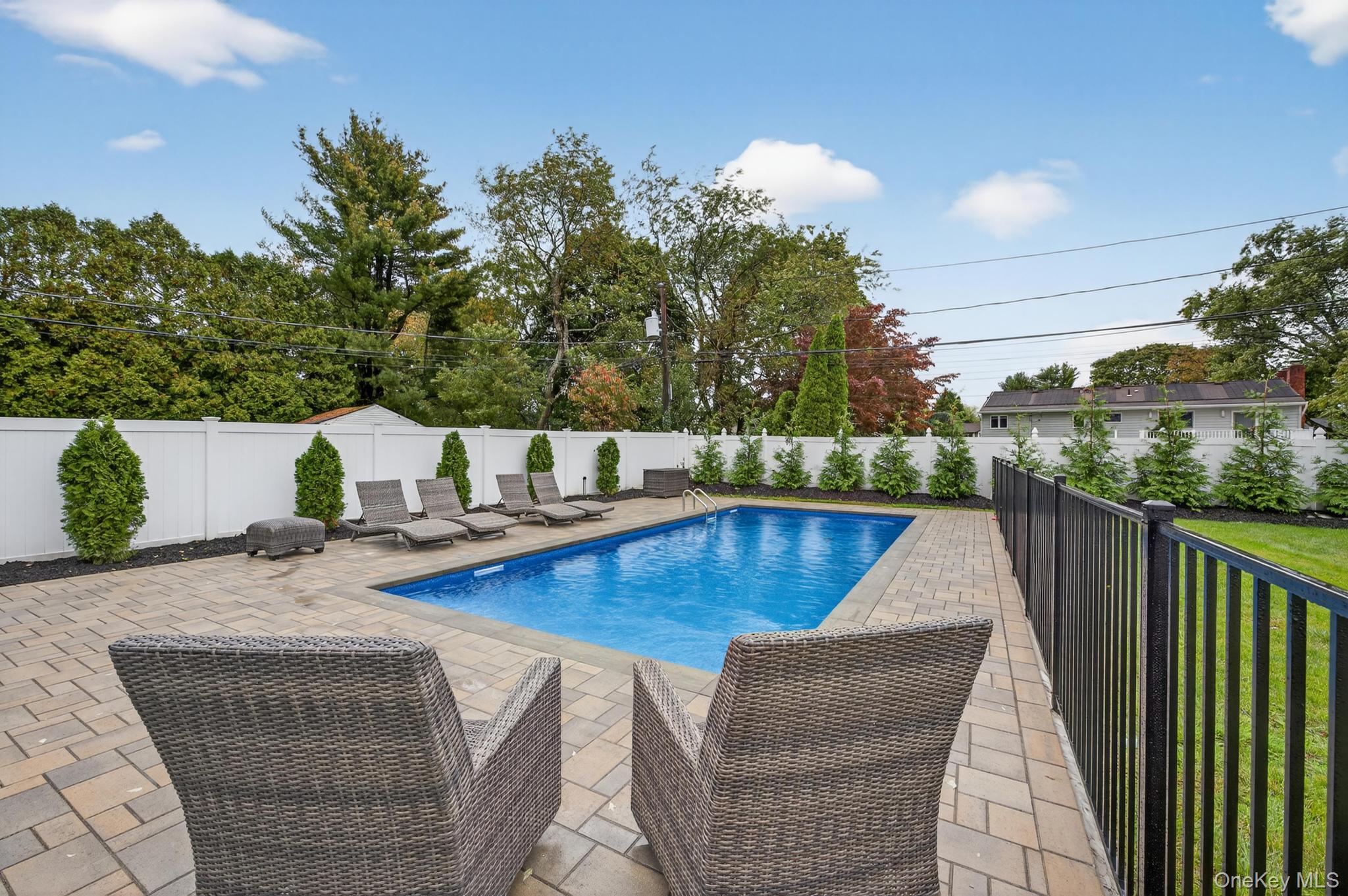 12 Farmstead Road Commack, NY 11725 - Photo 27 of 28 swimming pool view with a seating space