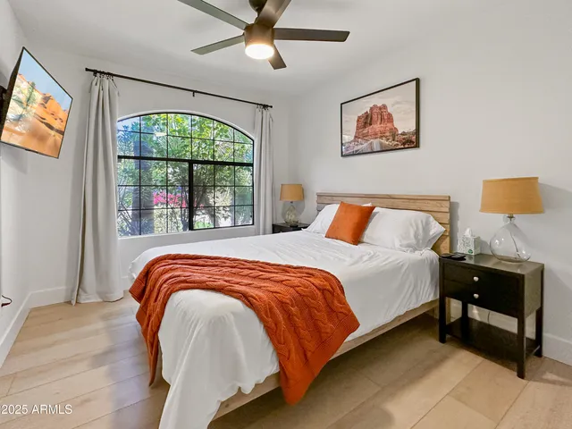 a bedroom with a bed and window