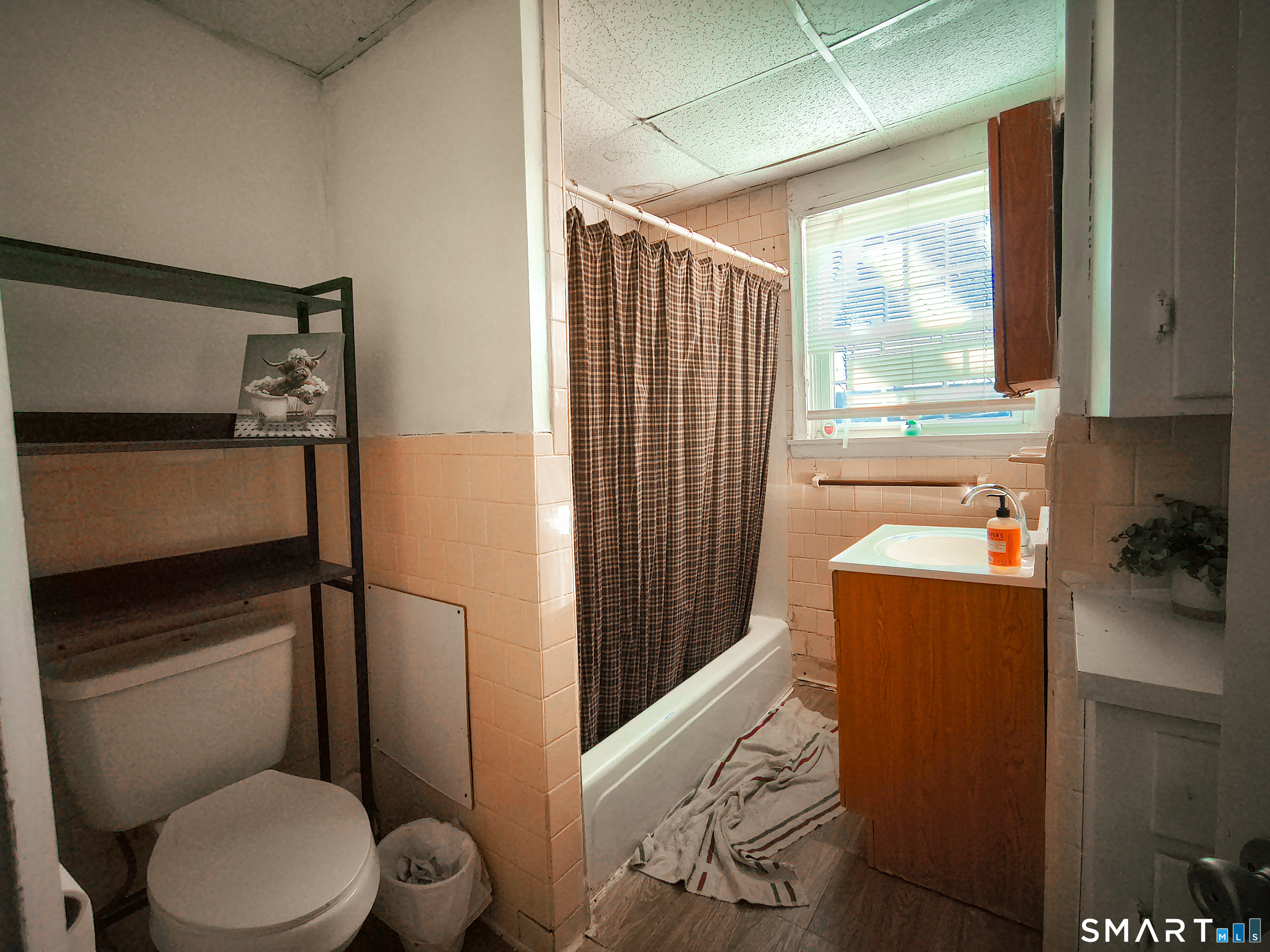 70 Walnut Street Putnam, CT 06260 - Photo 13 of 20 a bathroom with a toilet sink and mirror