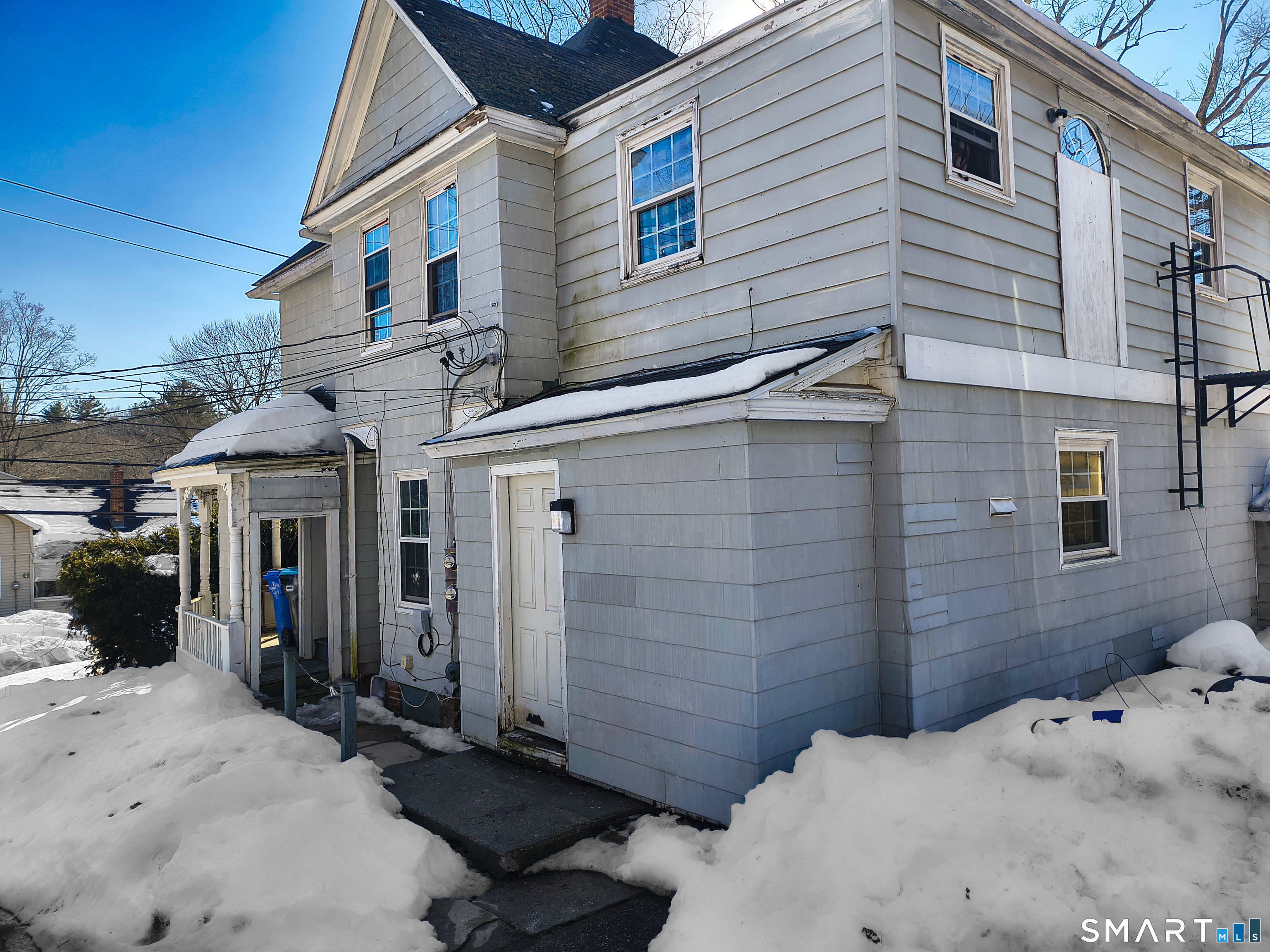 70 Walnut Street Putnam, CT 06260 - Photo 17 of 20 a side view of a house