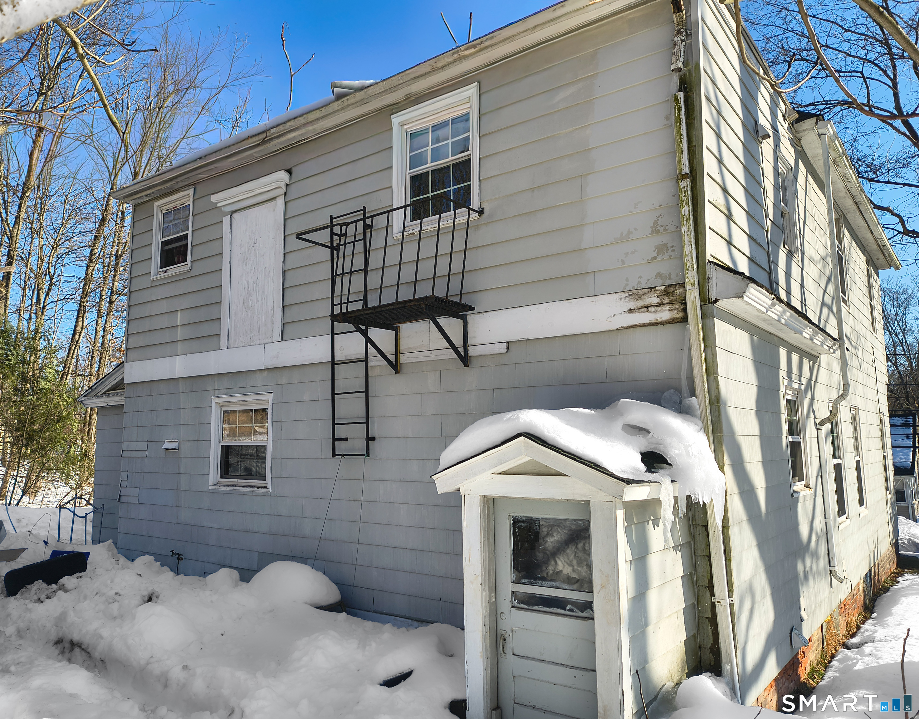70 Walnut Street Putnam, CT 06260 - Photo 18 of 20 a view of a house with a patio