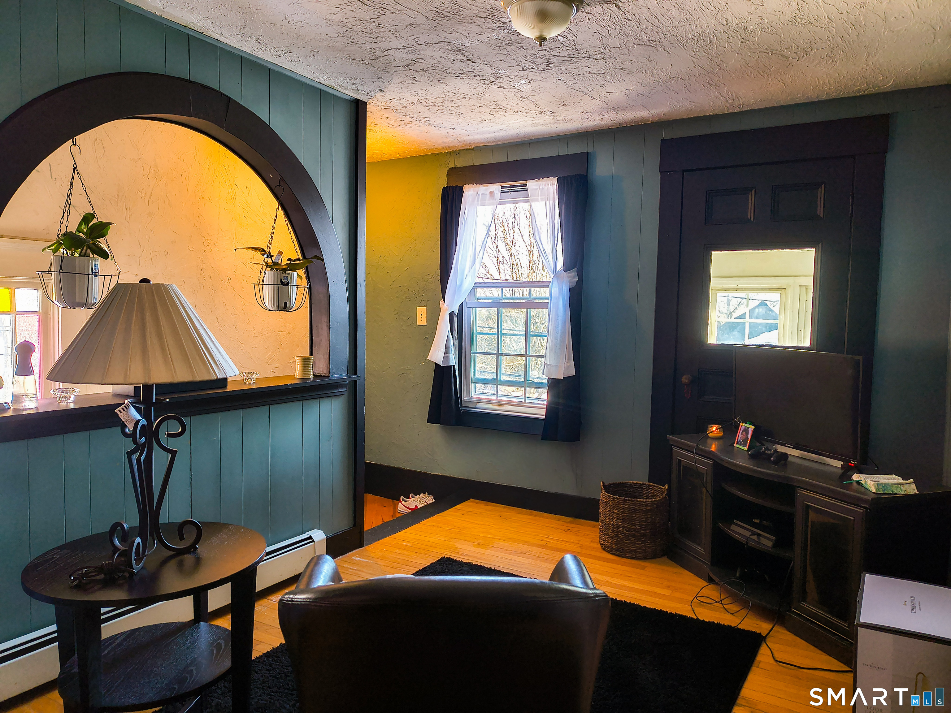 70 Walnut Street Putnam, CT 06260 - Photo 2 of 20 a room with furniture and a window