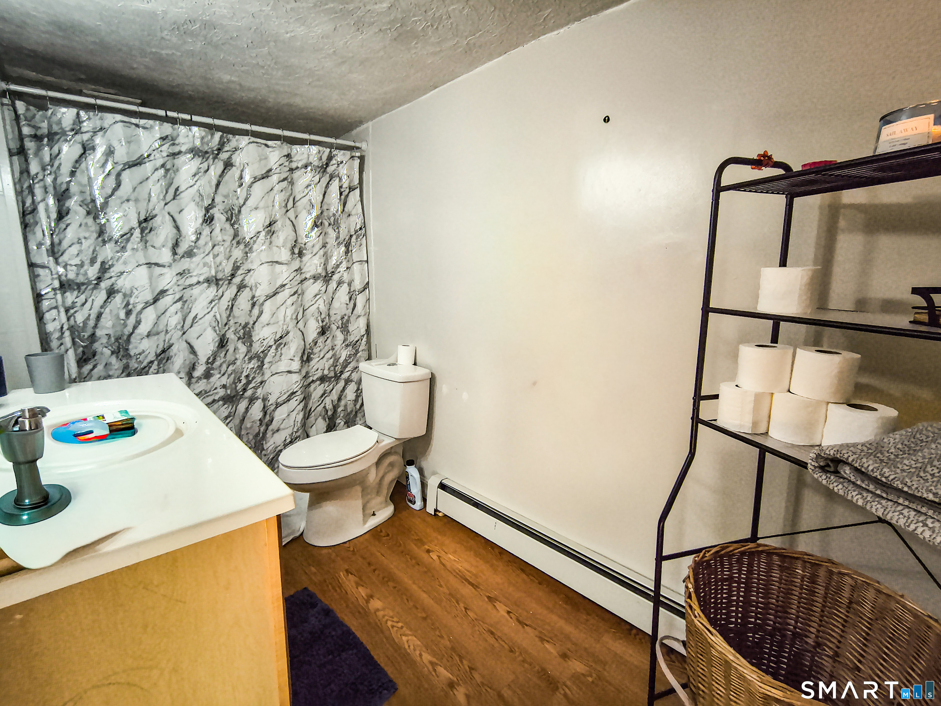 70 Walnut Street Putnam, CT 06260 - Photo 4 of 20 a bathroom with a sink toilet and shower