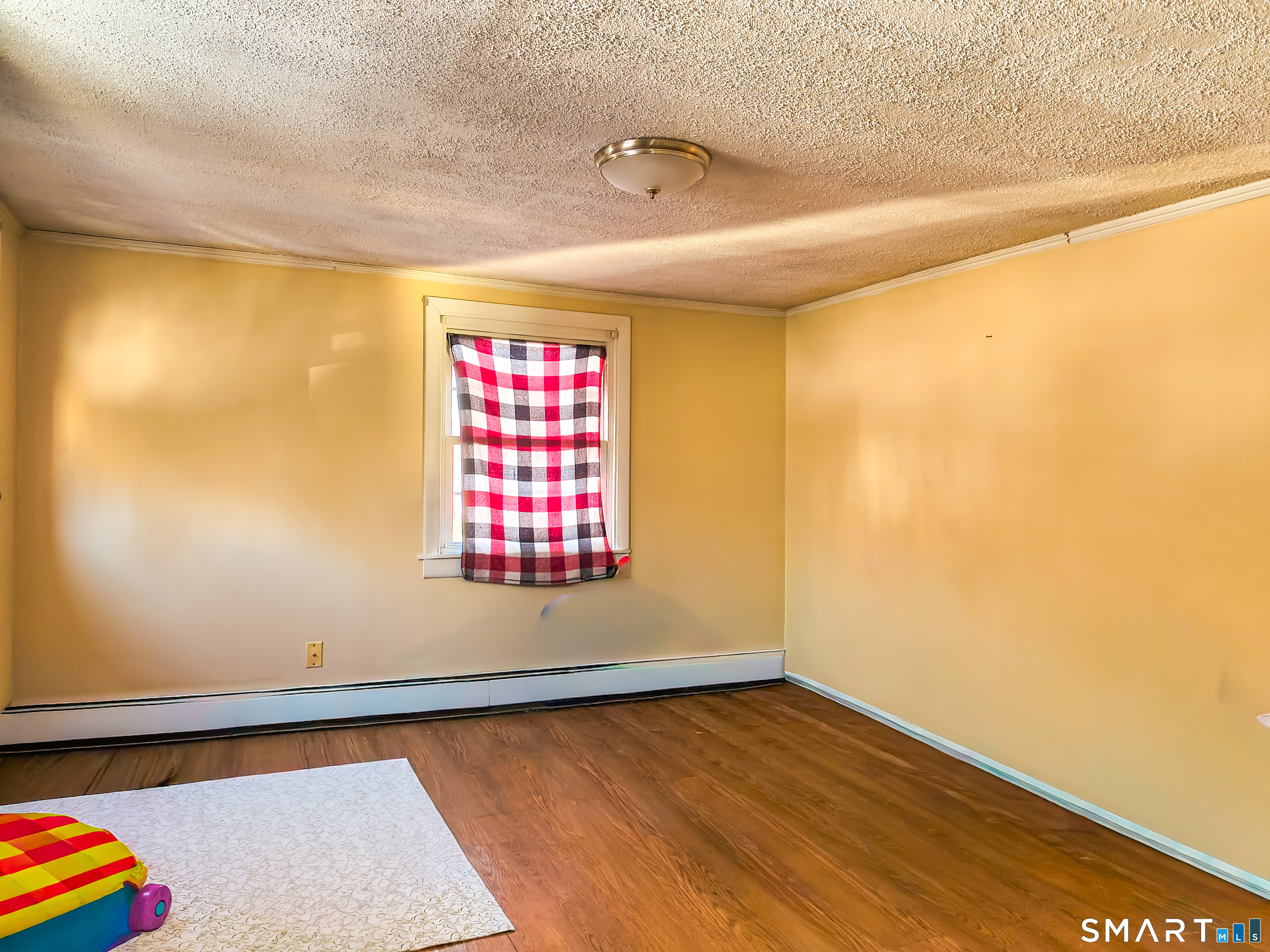 70 Walnut Street Putnam, CT 06260 - Photo 8 of 20 a view of an empty room and window