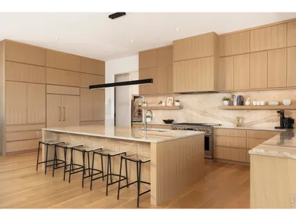 a kitchen with appliances cabinets and a sink