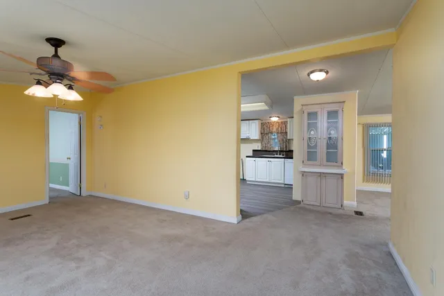 a view of a kitchen with a sink and cabinet area