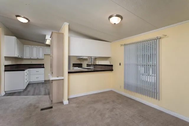 a view of a kitchen with a sink