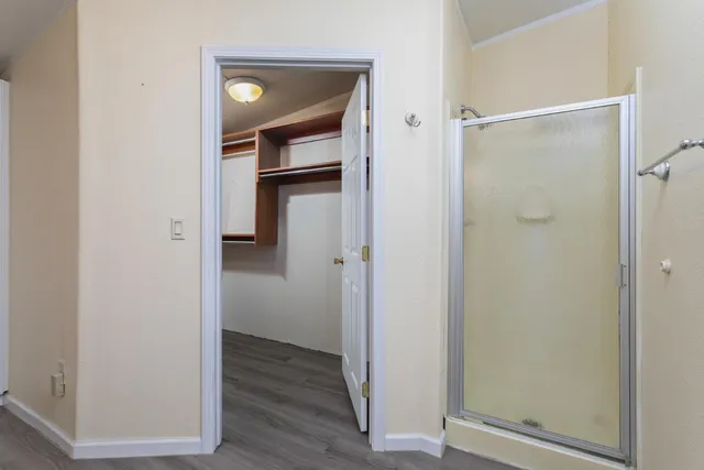 a view of bathroom with wooden floor
