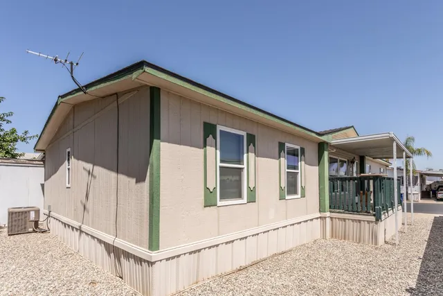 a view of a house with large windows