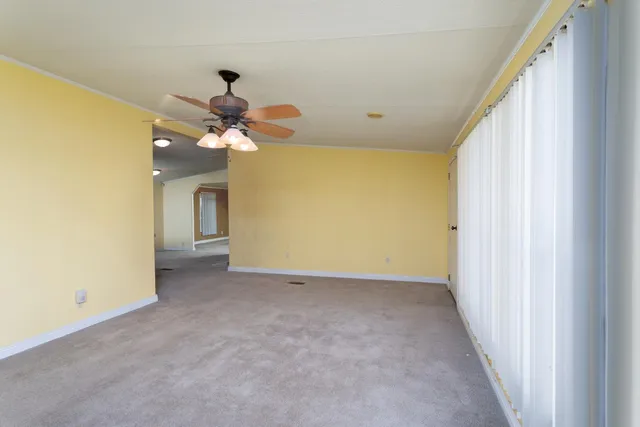 a view of a hallway with a chandelier