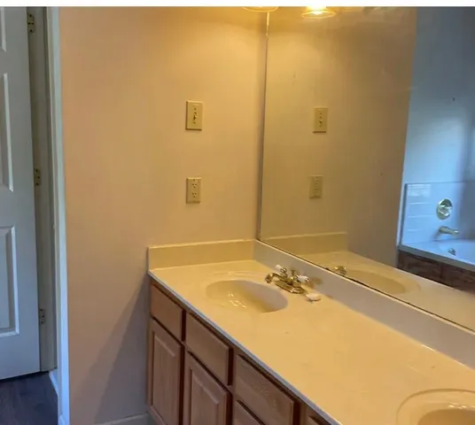 a view of a livingroom with a ceiling fan and window