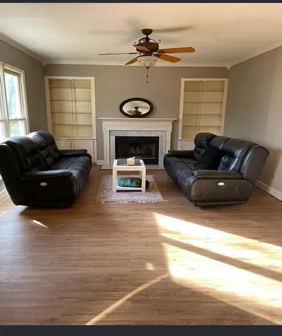 a kitchen with kitchen island a large counter top space appliances and cabinets