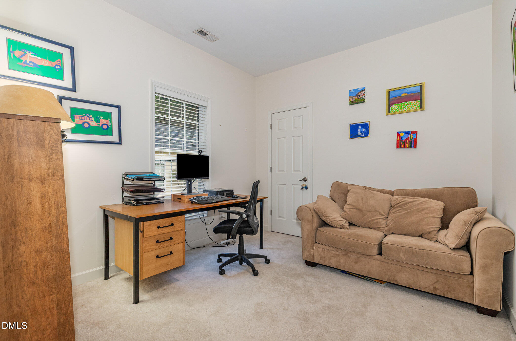 2541 Forest Shadows Lane Raleigh, NC 27614 - Photo 19 of 23 a livingroom with a workspace