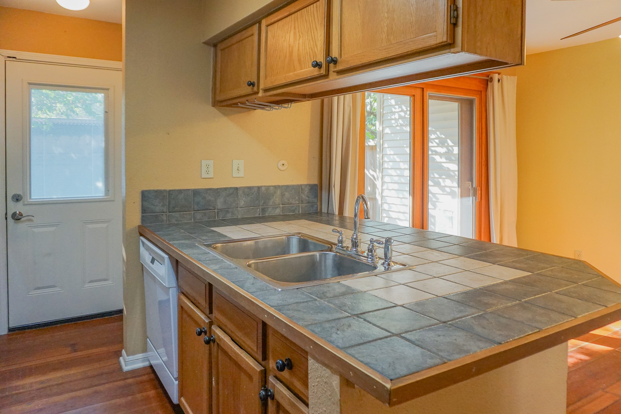 3100 Jeanetta Street, Unit 703 Houston, TX 77063 - Photo 14 of 42 a kitchen with a sink a counter top space and cabinets