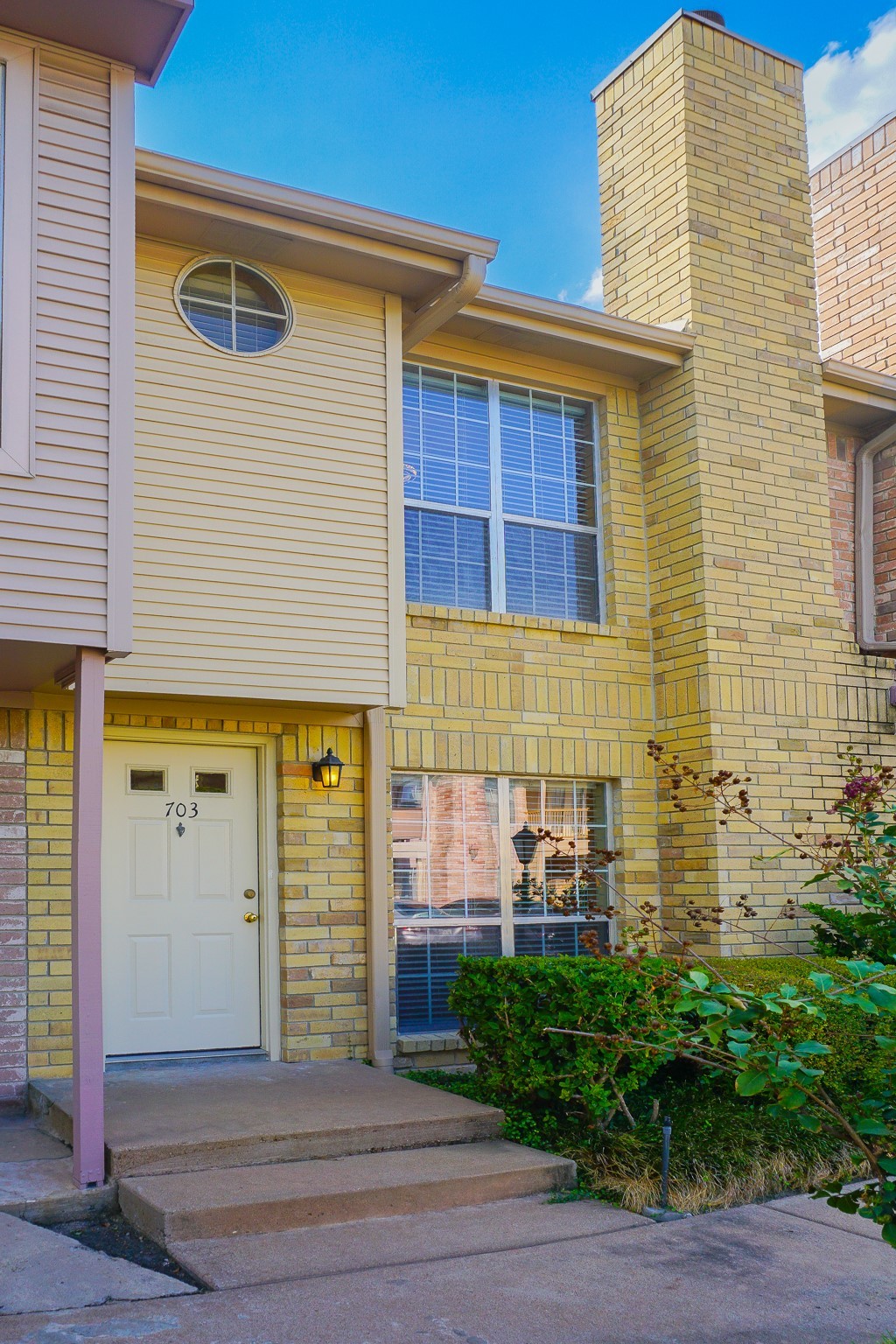 3100 Jeanetta Street, Unit 703 Houston, TX 77063 - Photo 2 of 42 a front view of a house with a yard