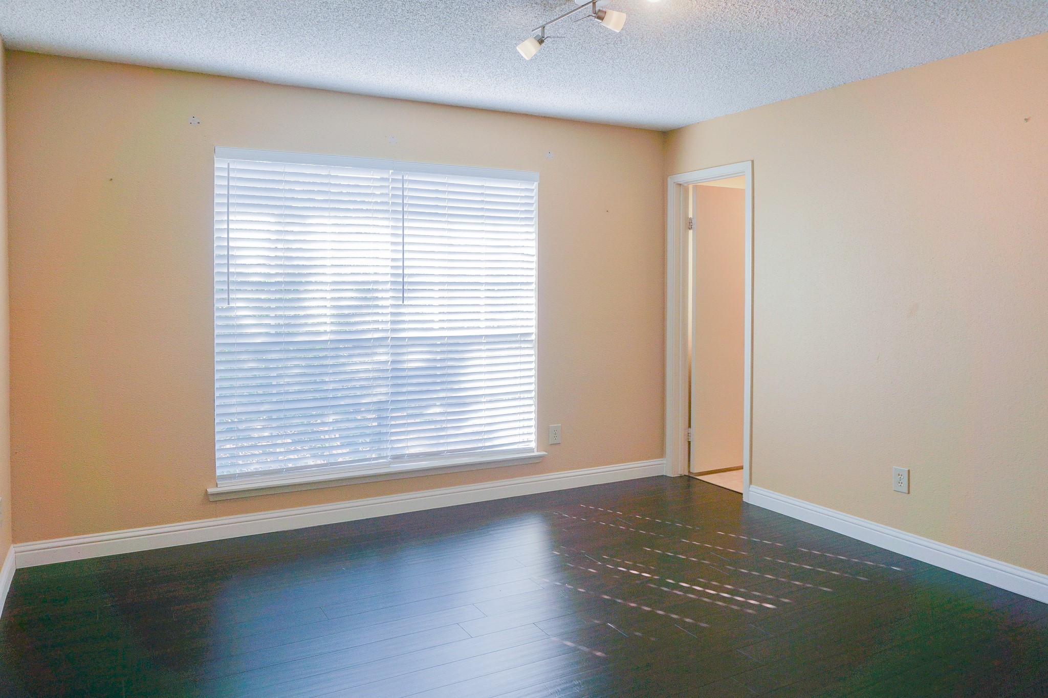 3100 Jeanetta Street, Unit 703 Houston, TX 77063 - Photo 21 of 42 an empty room with wooden floor and windows