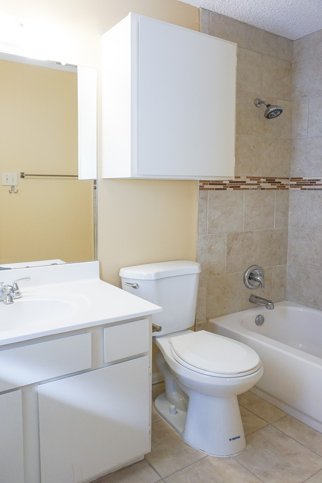 3100 Jeanetta Street, Unit 703 Houston, TX 77063 - Photo 23 of 42 a white toilet sitting next to a bathroom sink