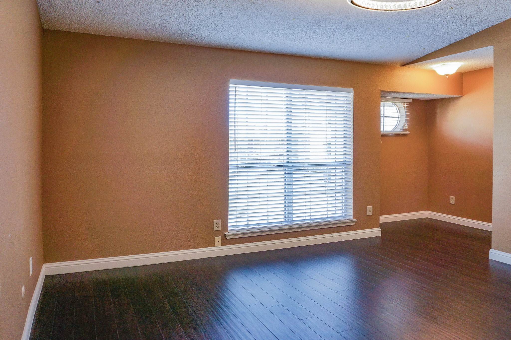 3100 Jeanetta Street, Unit 703 Houston, TX 77063 - Photo 24 of 42 an empty room with wooden floor and windows