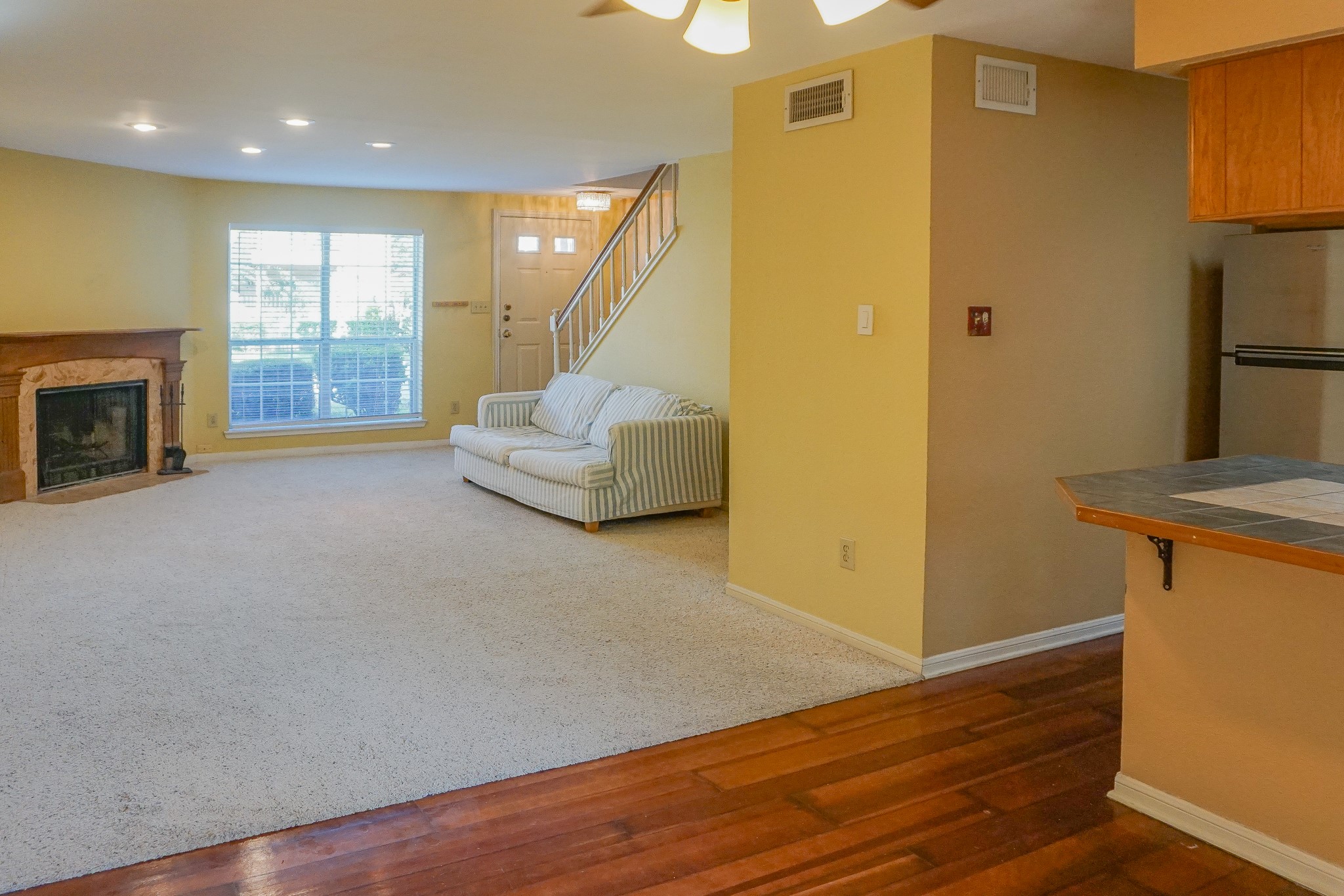 3100 Jeanetta Street, Unit 703 Houston, TX 77063 - Photo 30 of 42 a view of an empty room with wooden floor and a fireplace