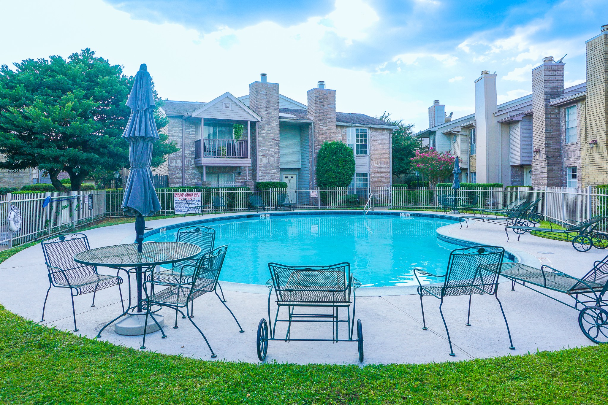 3100 Jeanetta Street, Unit 703 Houston, TX 77063 - Photo 37 of 42 a view of a chairs and table in patio with a yard